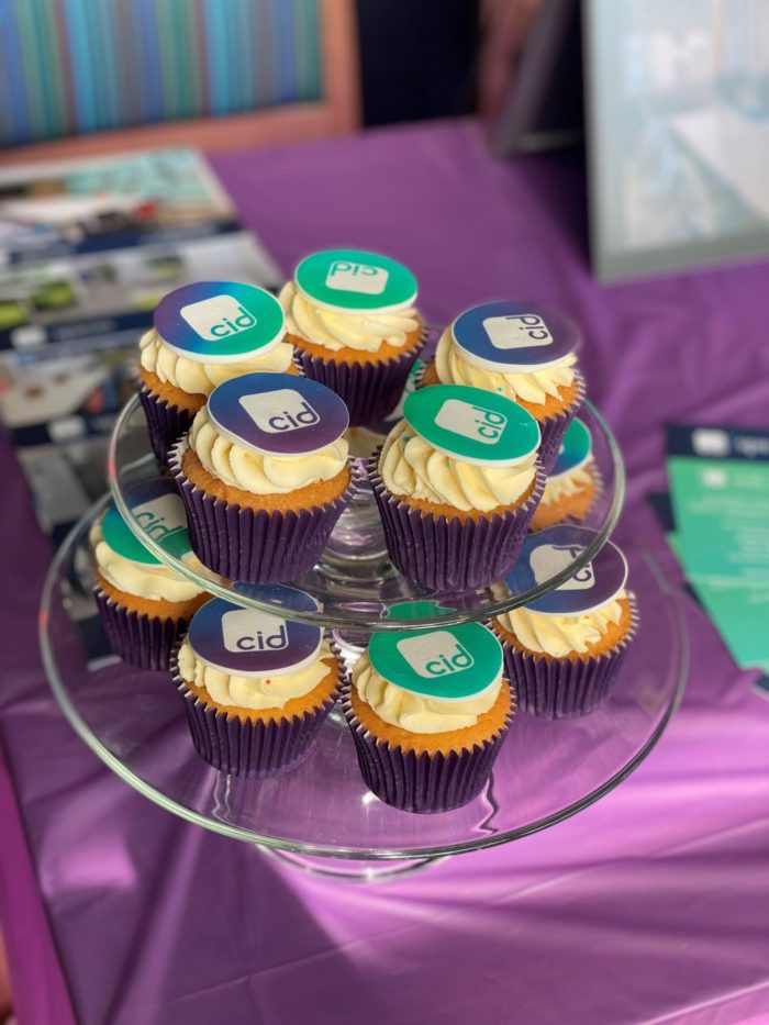 logo branded cupcakes at a know your neighbour event