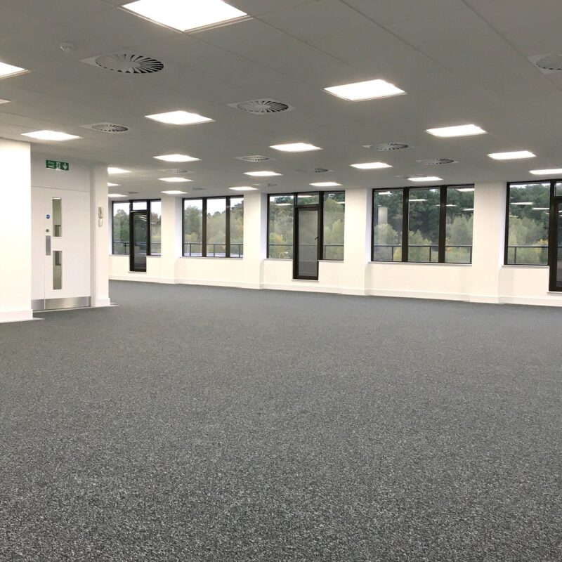 Completed Office Dilapidation featuring new ceiling, grey carpet and newly decorated white walls